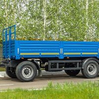 Трехосный прицеп  8332-0110130-04 бортовой